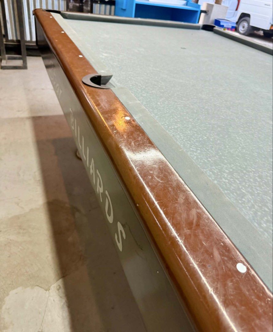 Star Billiards Maxima 7 Pool Table with Cues (Category: Billiards and Bowling) located in Manila. Submitted by miriamcfer28043 (Listing ID 1455407096, Image 3). Description: - Star Billiards Maxima 7 pool table - Includes billiard cues and balls - Grey felt playing surface - Dark brown wooden trim with minor scuffs - Ideal for game rooms or bars - Ready for pickup.