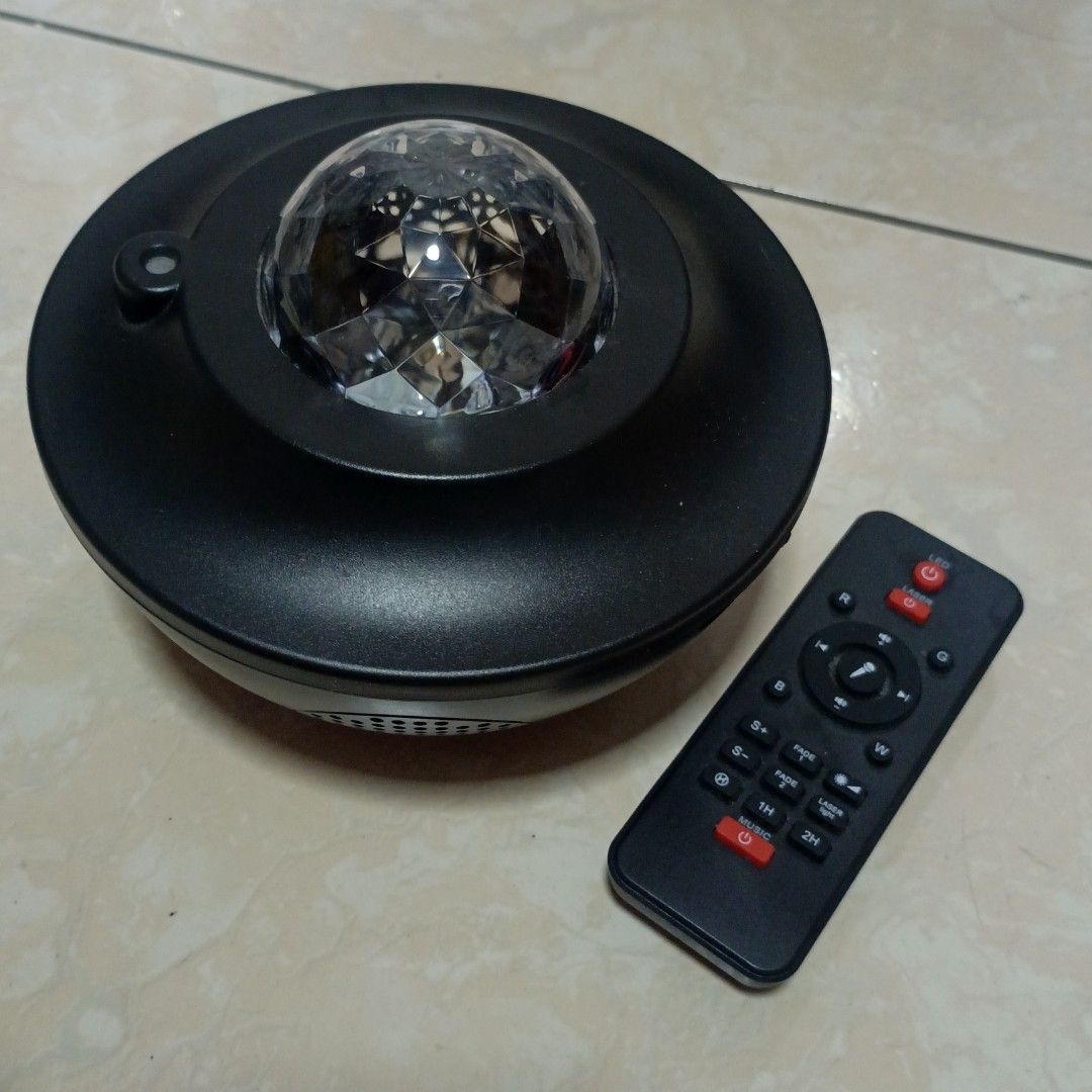 Starry Night Light with Bluetooth Speaker (Category: Projectors) located in Batangas. Submitted by forkeepsxo_ (Listing ID 1455457157, Image 1). Description: •well-used, still works great! •nightlight and bluetooth speaker in one •remote control has no battery (2 AAA) may guide buttons sa mismong nihhtlight (2nd pic) •maliwanag pa ang light and malinaw pa yung speaker •needs type c cable for charging •will give random freebies for sure buyers rfs