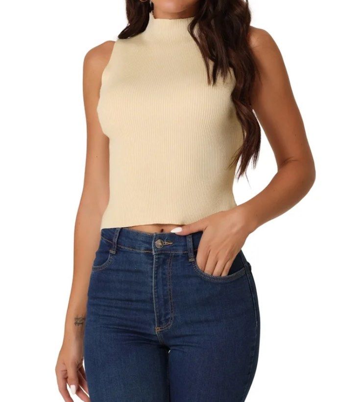 Topshop sleeveless ribbed mock-neck top (Category: Sleeveless) located in Nagcarlan. Submitted by snccollection (Listing ID 1455401648, Image 2). Description: TOPSHOP sleeveless ribbed mock-neck top in beige. Size: Large ; Worn for a few times and kept in the closet. Timeless top. RFS: doesn’t fit anymore.