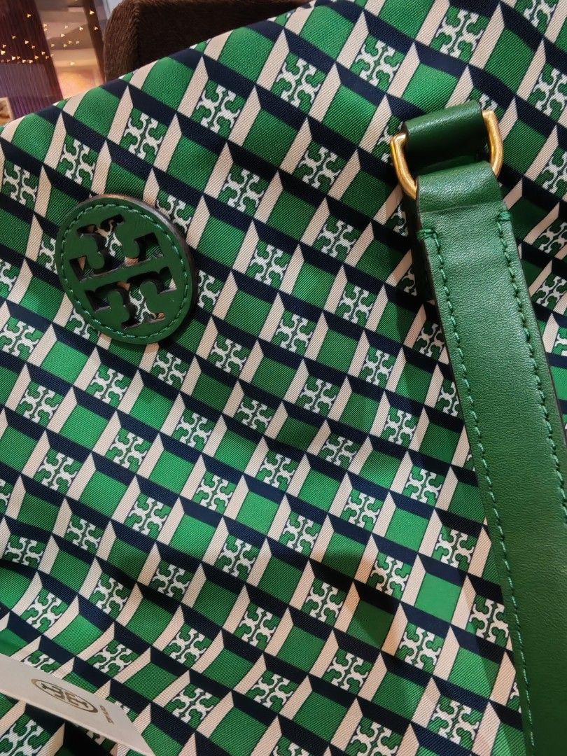 Tory Burch Tote Bag - Green Monogram (Category: Luxury Bags & Wallets) located in Caloocan City. Submitted by mommyella22 (Listing ID 1455427482, Image 2). Description: - Authentic Green Tory Burch Tote Bag - Signature Monogram Print - Genuine Leather Trim and Handles - Brand New with Original Tag Attached - Spacious Interior - Ideal for Everyday or Travel - Stylish and Practical Accessory.