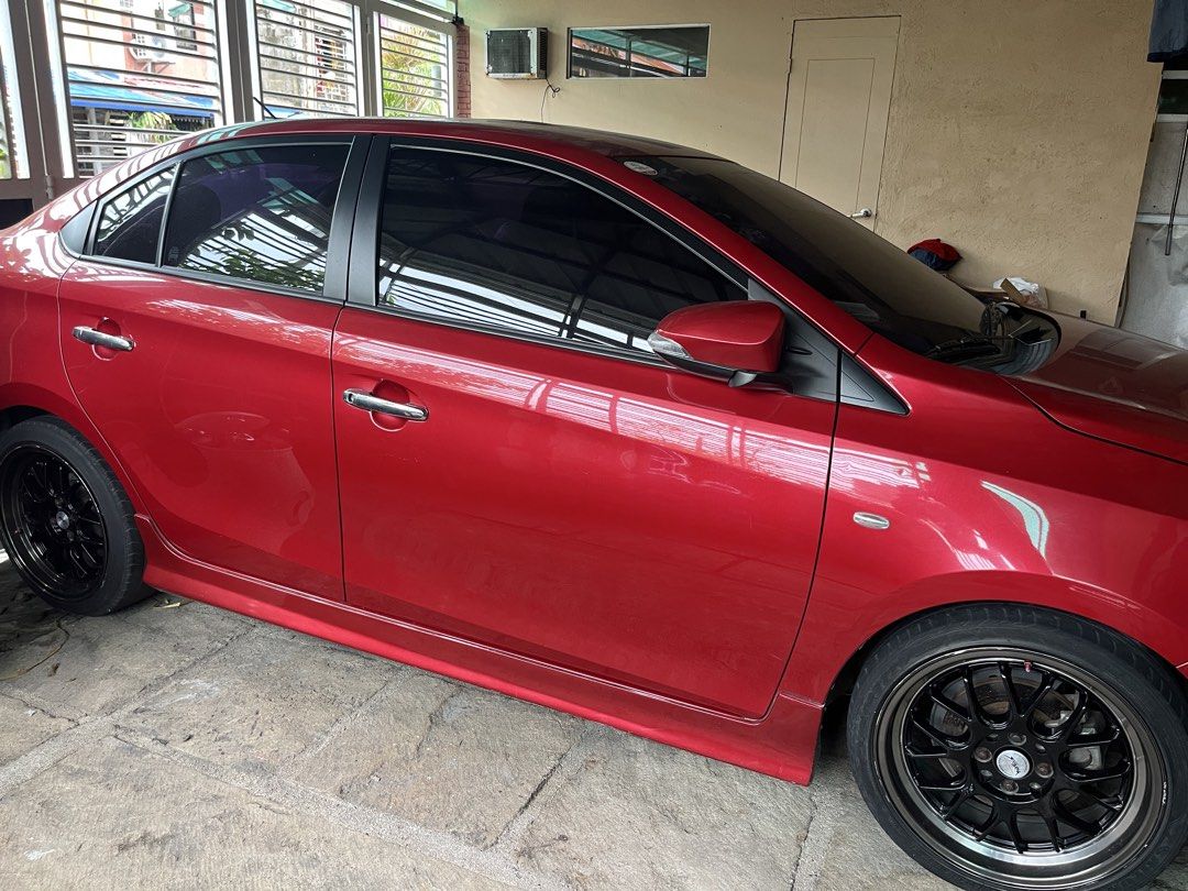 Toyota Vios 1.5 J (M) (Category: Used Cars) located in Manila. Submitted by peterlowell.tadaya (Listing ID 1455351131, Image 3). Description: Toyota vios 2014-15 1.3 J variant, manual. Looks E variant na. Modified sidelamp. Wetlook pa din dahil naka 5x ceramic coat applied from the day lumabas sa casa. Minor Hairline scratches due to usage. Pero wax and buff lang solve na. Original pain. Red mica metallic, Very good condition. Original odo meter.