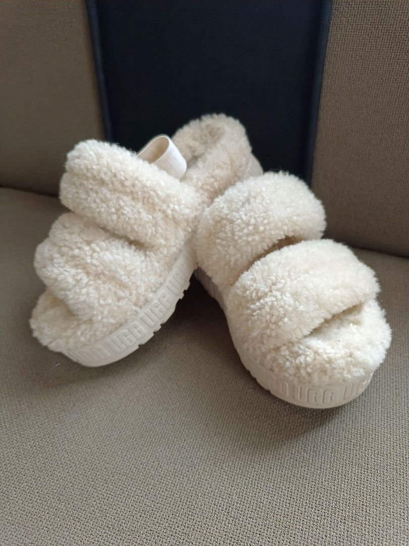 UGG Fluff Sandals Slide Slippers Cream RUSH SALE! (Category: Slippers and slides) located in Mandaluyong City. Submitted by mskitty_02 (Listing ID 1455369043, Image 1). Description: - Cream UGG Fluff Yeah slides -Fixed Price -Size 36 can also fit US 6 ( Im US 6 , 36-37 ) -Selling low -100% Original - Super soft and fluffy material - Elastic strap at the back with UGG logo - Platform sole for added style and comfort - Ideal for lounging or quick e