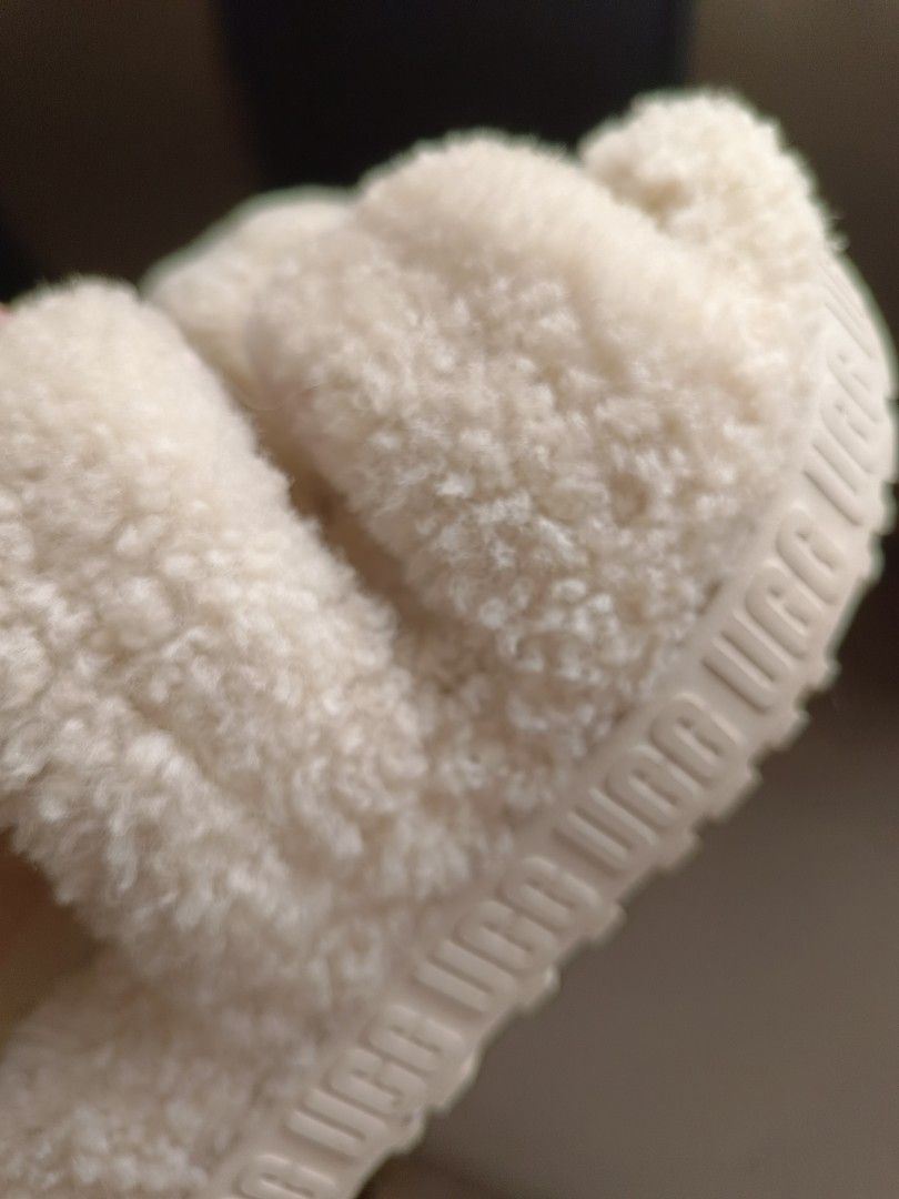 UGG Fluff Sandals Slide Slippers Cream RUSH SALE! (Category: Slippers and slides) located in Mandaluyong City. Submitted by mskitty_02 (Listing ID 1455369043, Image 2). Description: - Cream UGG Fluff Yeah slides -Fixed Price -Size 36 can also fit US 6 ( Im US 6 , 36-37 ) -Selling low -100% Original - Super soft and fluffy material - Elastic strap at the back with UGG logo - Platform sole for added style and comfort - Ideal for lounging or quick e