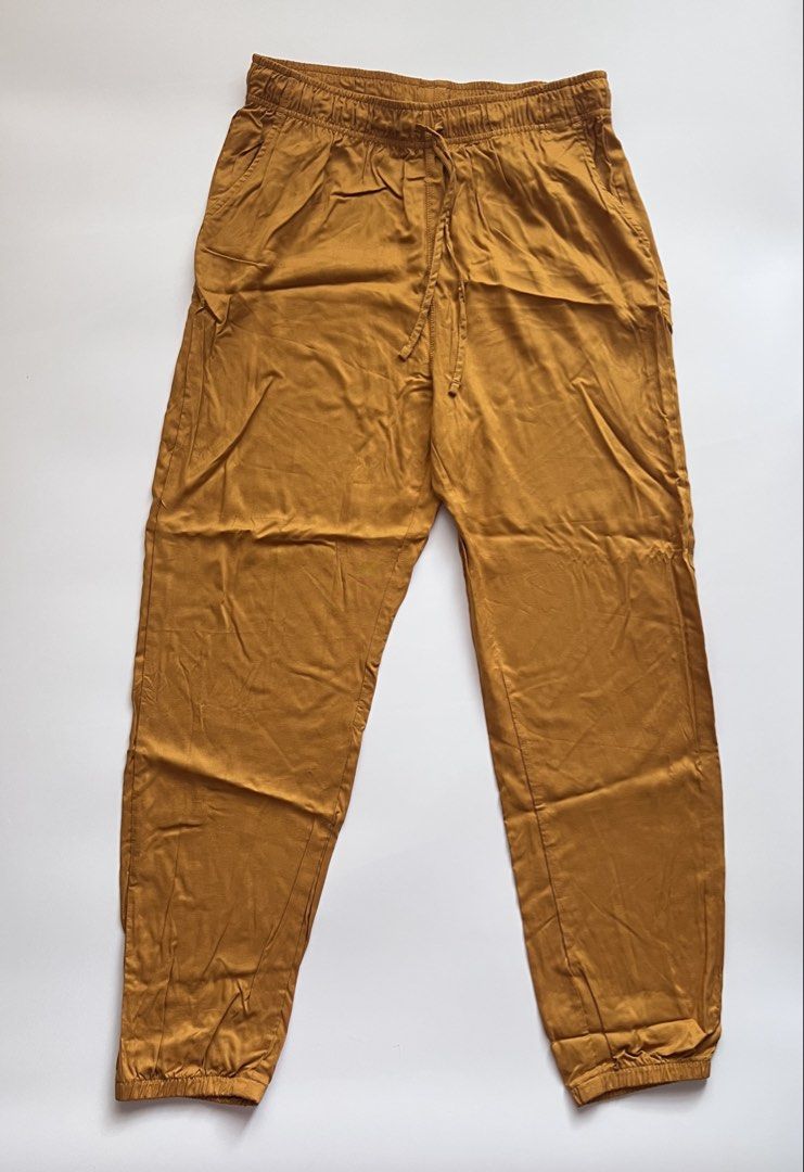uniqlo yellow drape jogger pants (Category: Other Bottoms) located in Dasmarinas. Submitted by pinex (Listing ID 1455415716, Image 2). Description: - barely used, color/shine still amazing - 100% rayon.