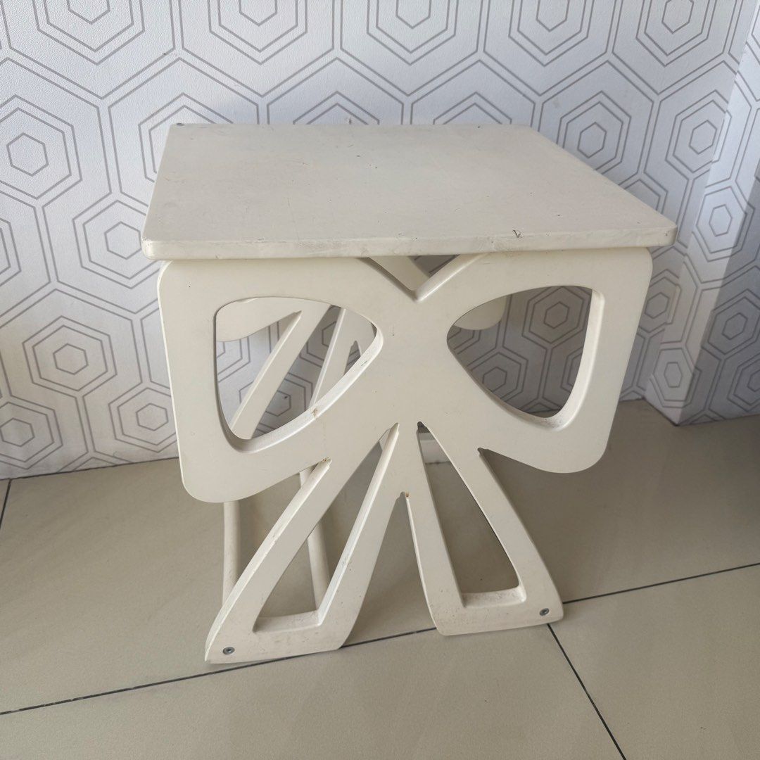 White Bow Design Side Table (Category: Tables & Sets) located in Marikina City. Submitted by lovegoeson (Listing ID 1455484168, Image 1). Description: - Cute white side table with unique bow-designed legs. - Versatile: Perfect as a small accent table or a bedside table. - Condition: Top surface has some marks and scuffs from normal use. - Overall: A charming piece that will add character to any room..