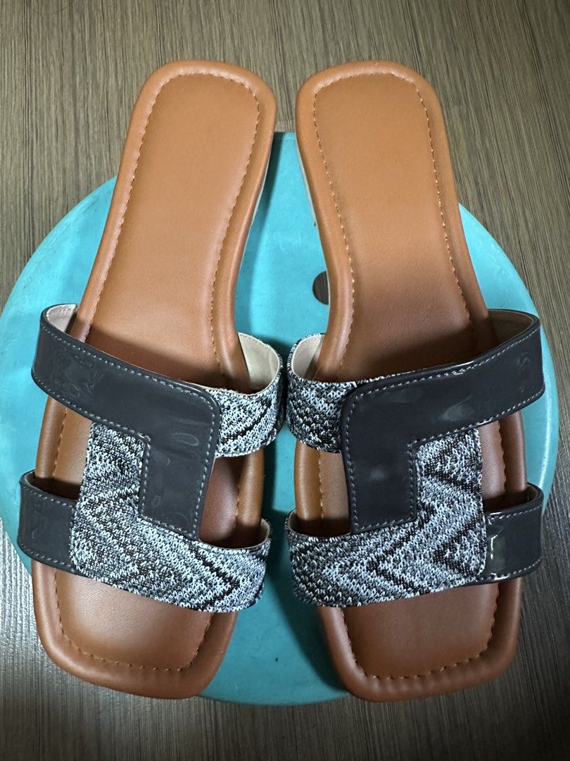 Women's Flat Sandals with Patterned Straps (Category: Flats & Sandals) located in Quezon City. Submitted by declutter_incorporated (Listing ID 1455373852, Image 3). Description: - Comfortable flat sandals for everyday wear. - Stylish H-strap design with patterned fabric detail. - Durable rubber sole. - Easy slip-on and off. - Ideal for casual outings and running errands. - Relaxed fit with a chic look. - Used once just inside the house but it was