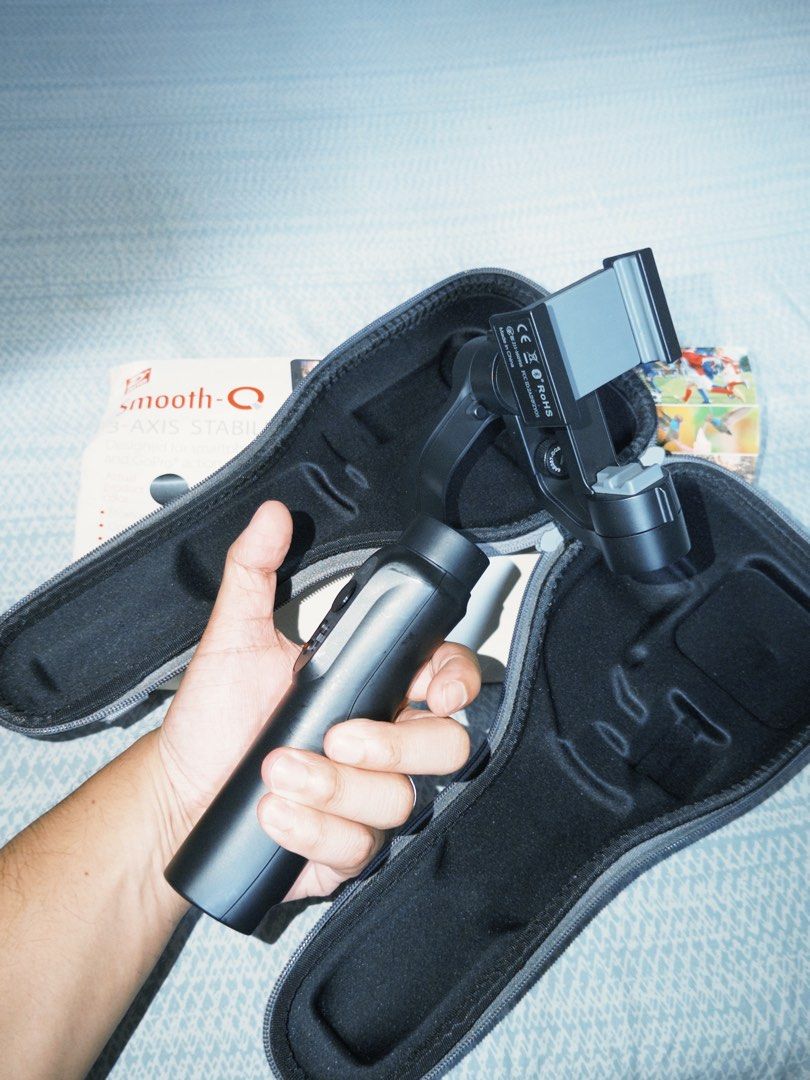 Zhiyun Smooth-Q 3-Axis Stabilizer 📱 (Category: Gimbals & Stabilizers ) located in Makati City. Submitted by ray_sells (Listing ID 1455398894, Image 2). Description: Zhiyun Smooth-Q 3-Axis Stabilizer 📱 Selling my Zhiyun Smooth-Q 3-Axis Stabilizer, designed for smartphones and GoPro action cameras. An older model, but still working properly. It was never used, and the stabilizer itself remains in good condition. The box and case show some signs o