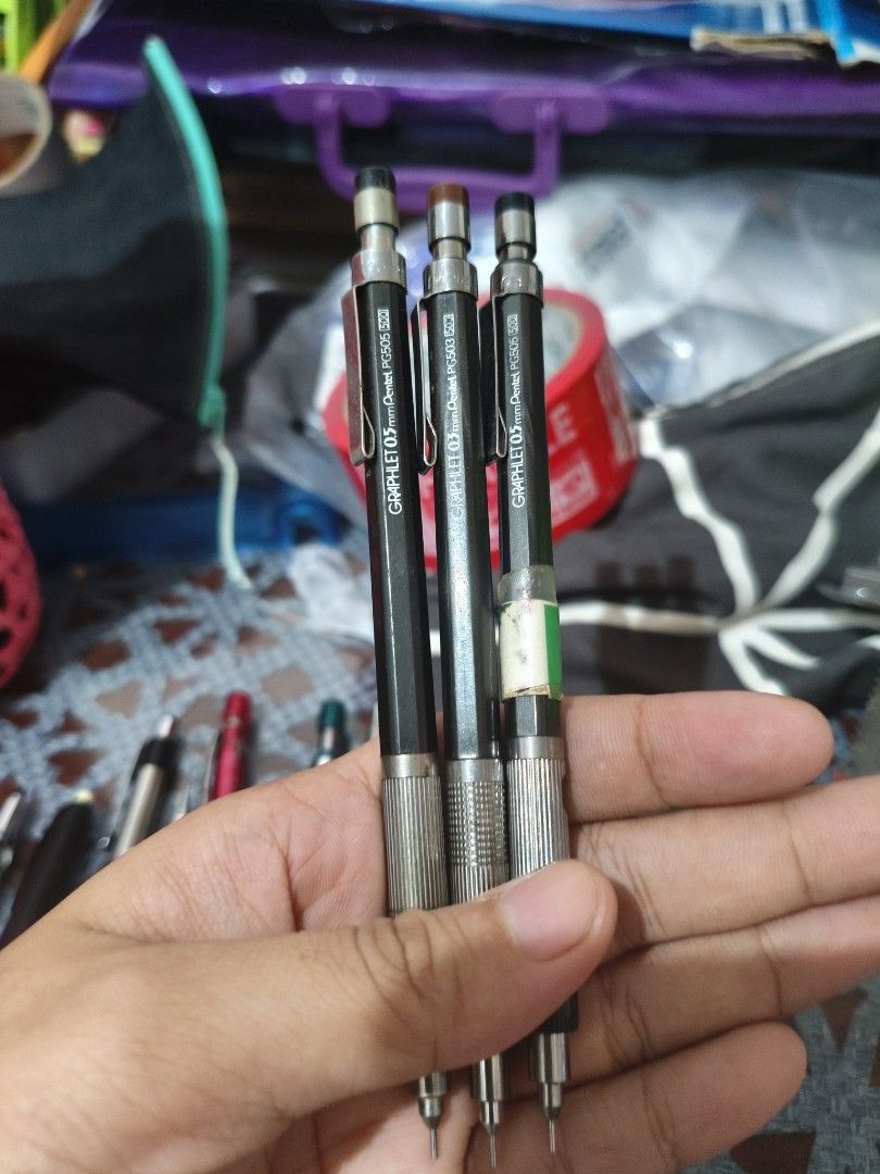 3x Pentel Graphlet 0.5mm Mechanical Pencils PG505 (Category: Stationery & School Supplies) located in Arayat. Submitted by jpfinds19 (Listing ID 1455501020, Image 2). Description: - Set of 3 Pentel Graphlet mechanical pencils - 0.5mm lead size (Model PG505) - Classic black barrels with silver grips - One pencil has minor tape residue on the barrel - Ideal for both drawing and writing - Great value bundle - get all three together!.