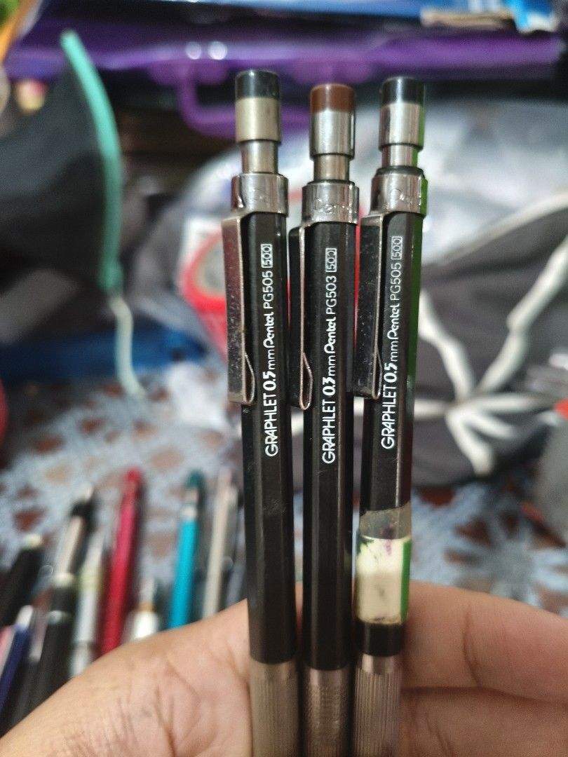3x Pentel Graphlet 0.5mm Mechanical Pencils PG505 (Category: Stationery & School Supplies) located in Arayat. Submitted by jpfinds19 (Listing ID 1455501020, Image 1). Description: - Set of 3 Pentel Graphlet mechanical pencils - 0.5mm lead size (Model PG505) - Classic black barrels with silver grips - One pencil has minor tape residue on the barrel - Ideal for both drawing and writing - Great value bundle - get all three together!.