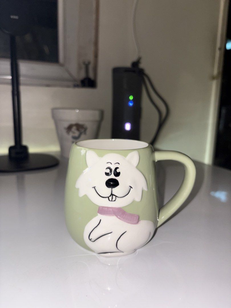🐱 Cute White Cat Ceramic Mug Embossed (Category: Coffee & Tea Tableware) located in Caloocan City. Submitted by rabbithole2026 (Listing ID 1453813248, Image 1). Description: Adorable ceramic mug featuring a raised 3D white cat design with a pink scarf on a soft green background. Perfect for coffee, tea, hot chocolate, or as a gift for cat lovers. ✅ Good pre-owned condition ✅ No chips or cracks observed ✅ Raised 3D cat design ✅ Soft pastel colors