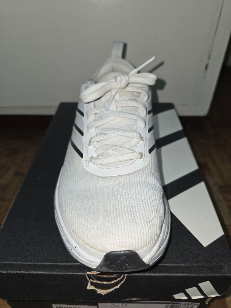Adidas JOGIT M Running Shoes White (Category: Casual Shoes) located in Binan City. Submitted by dddcn (Listing ID 1455511697, Image 3). Description: - Adidas JR0862 JOGIT M Running Shoes - Color: White - Size: 7 US Men's (6.5 UK, 40 EU, 245mm) - Features speckled sole detail - Comes with original box - Ideal for running and casual wear.