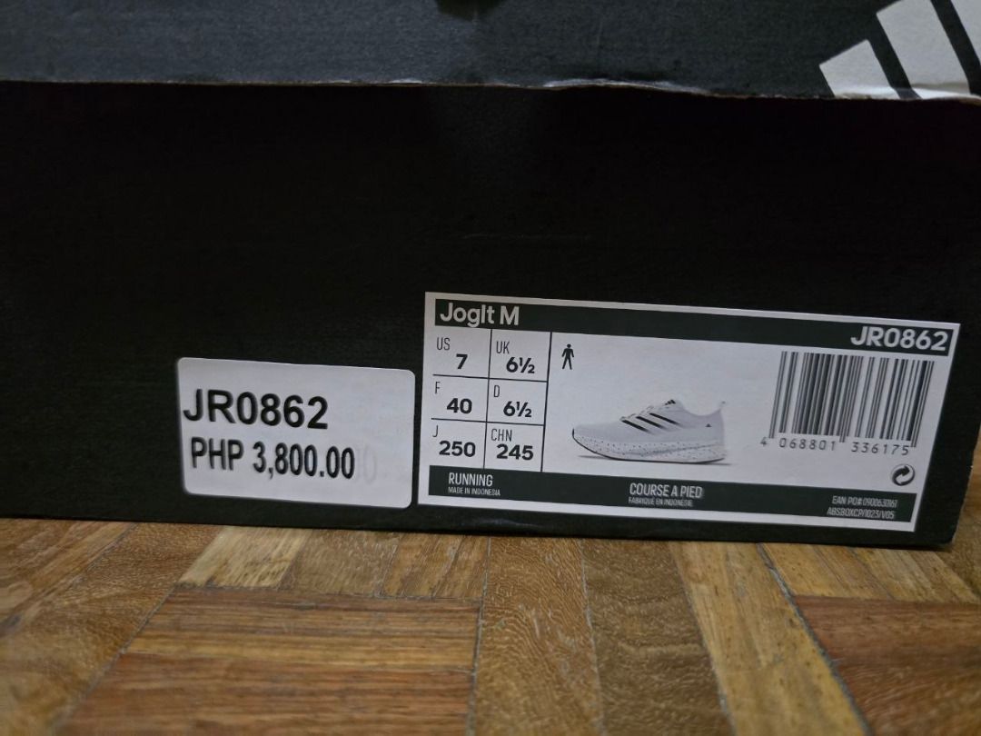Adidas JOGIT M Running Shoes White (Category: Casual Shoes) located in Binan City. Submitted by dddcn (Listing ID 1455511697, Image 2). Description: - Adidas JR0862 JOGIT M Running Shoes - Color: White - Size: 7 US Men's (6.5 UK, 40 EU, 245mm) - Features speckled sole detail - Comes with original box - Ideal for running and casual wear.