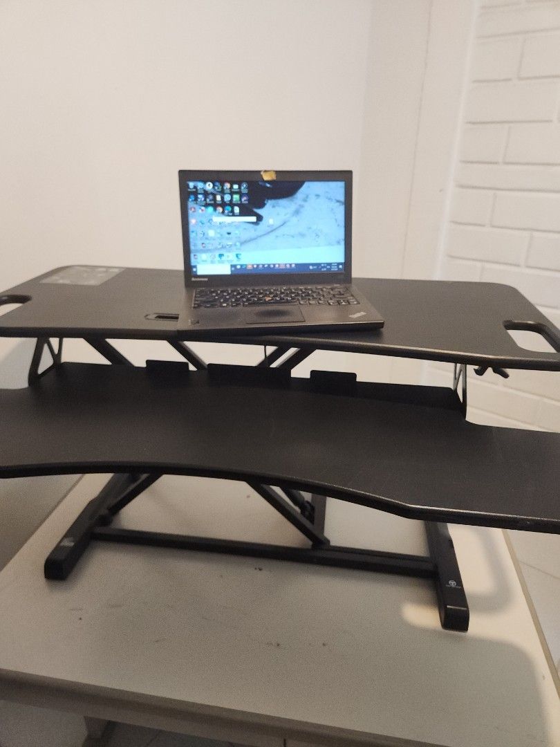 Adjustable Standing Desk Converter for Desktops (Category: Office Furniture & Fixtures) located in Santa Rosa. Submitted by techsella (Listing ID 1455619294, Image 3). Description: - used with torn screw underneath. this does not affect any of the functionality or the strength. perfect working gas lift mechanism Standing desk converter that sits on your current desk. - Effortlessly adjust height for sitting or standing positions. - Comes with a k