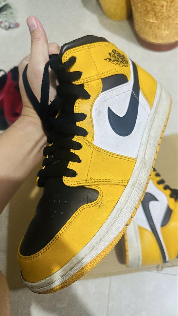 Air Jordan 1 High Yellow Black White (Category: Sneakers) located in Bulacan. Submitted by jamescarl1421 (Listing ID 1455583389, Image 2). Description: Selling my Air Jordan 1 Mid “Taxi” / Yellow Toe in US Men’s 10 / UK 9 / EU 44. * Style code: 554724-701 * Colorway: Taxi / White / Black * Original Jordan box included * Black laces * Used condition * Shows normal signs of wear/creasing from use * Midsoles/outsoles have some dirt and wear, as show