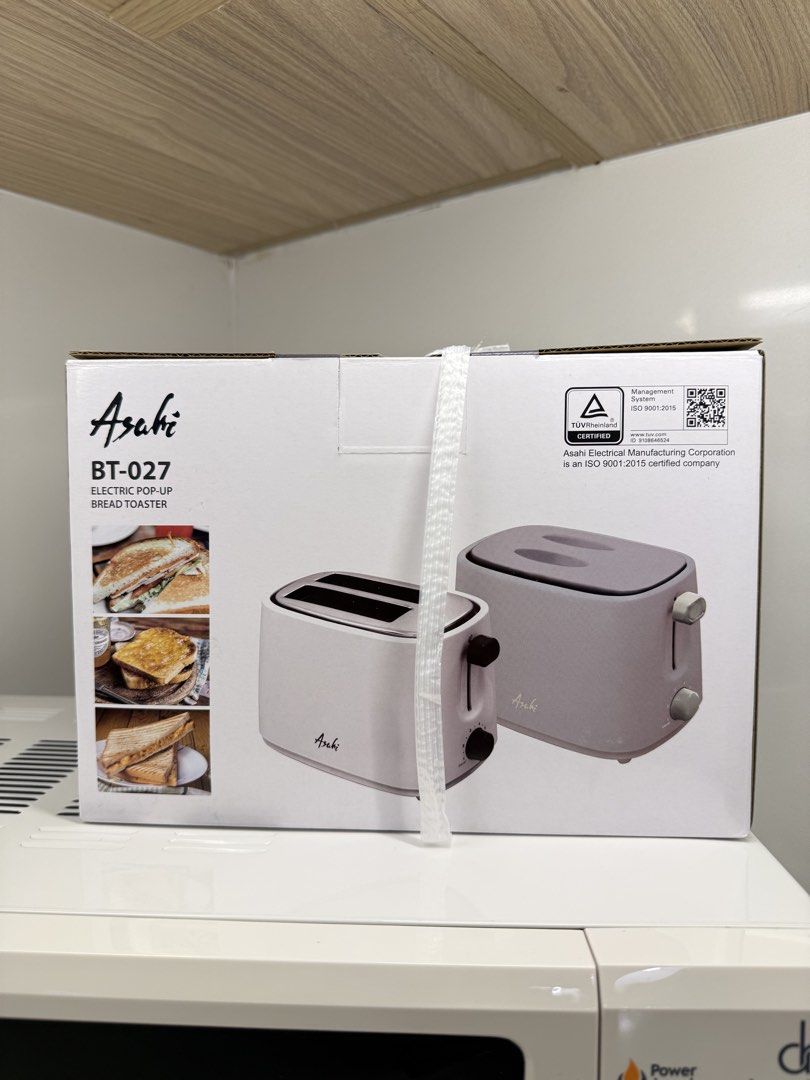 Asahi BT-027 Electric Pop-Up Bread Toaster (Category: Ovens & Toasters) located in Quezon City. Submitted by miccachic (Listing ID 1455554577, Image 1). Description: - Asahi BT-027 Electric Pop-Up Bread Toaster - Simple and functional for your breakfast needs - Box features images of delicious toast and sandwiches - ISO 9001:2015 certified by Asahi Electrical Manufacturing Corporation.