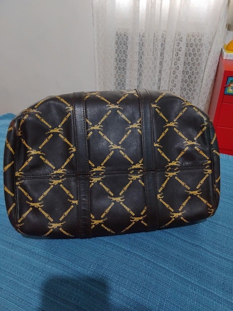 Authentic Longchamp Vintage Monogram Leather Boston Bag in 30 (Category: Luxury Bags & Wallets) located in Manila. Submitted by daronandtruffles (Listing ID 1455586008, Image 3). Description: - Vintage Longchamp satchel bag - Classic gold monogram print on dark brown leather - Genuine leather handles and trim - Secure zipper closure - Authentically made in France Material: Full grain leather inside and out Faded tag but it is Made in France Dimen