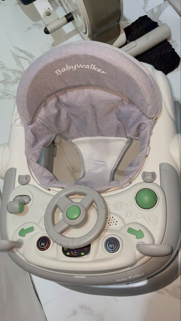 Baby Walker with Push Handle, Adjustable Height, Brake Assist (Category: Infant Playtime) located in Manila. Submitted by mightymountain_47fe28 (Listing ID 1455523489, Image 3). Description: - Grey baby walker - Variable speed and height adjustment - Safety brake assist - Foldable for easy storage - Parent push handle included - Padded seat for comfort - Helps baby learn to walk.
