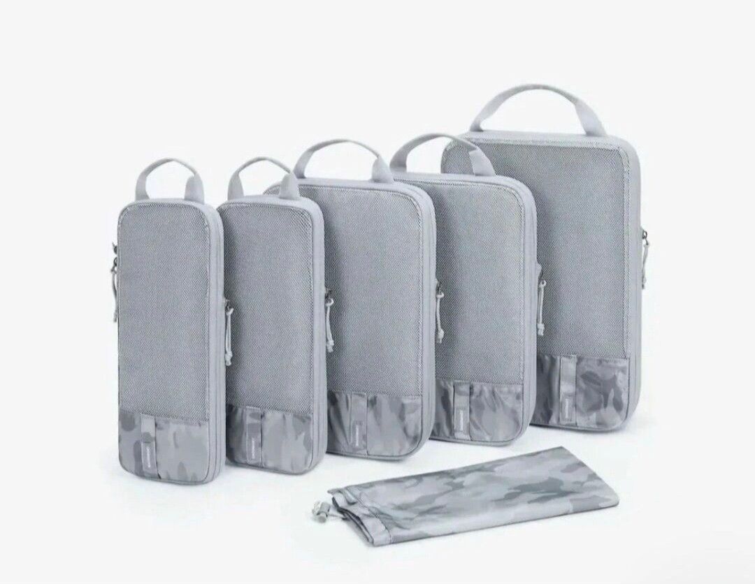 BAGSMART COMPRESSION PACKING CUBES SET-GRAY (Category: Travel Essentials & Accessories) located in Quezon City. Submitted by stuffiesetc (Listing ID 1455640709, Image 1). Description: BAGSMART COMPRESSION PACKING CUBES SET-GRAY Guaranteed authentic. Brand new in sealed packaging. DESCRIPTION LIGHT-WEIGHT TRAVEL ACCESSORIES: The packing organizers are lightweight, stylish, and designed to fit easily into carry-on suitcases. TRUE SPACE SAVING: They