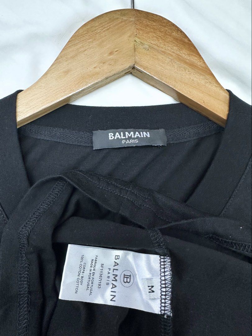 BALMAIN - Crystal Embellished Logo Shirt (Category: Shirts) located in Cavite. Submitted by hand.picked (Listing ID 1455620816, Image 2). Description: BALMAIN - Crystal Embellished Logo Shirt Size: Medium Measurement: 19” Width / 25” Length Condition: Excellent Note: Missing some stones.