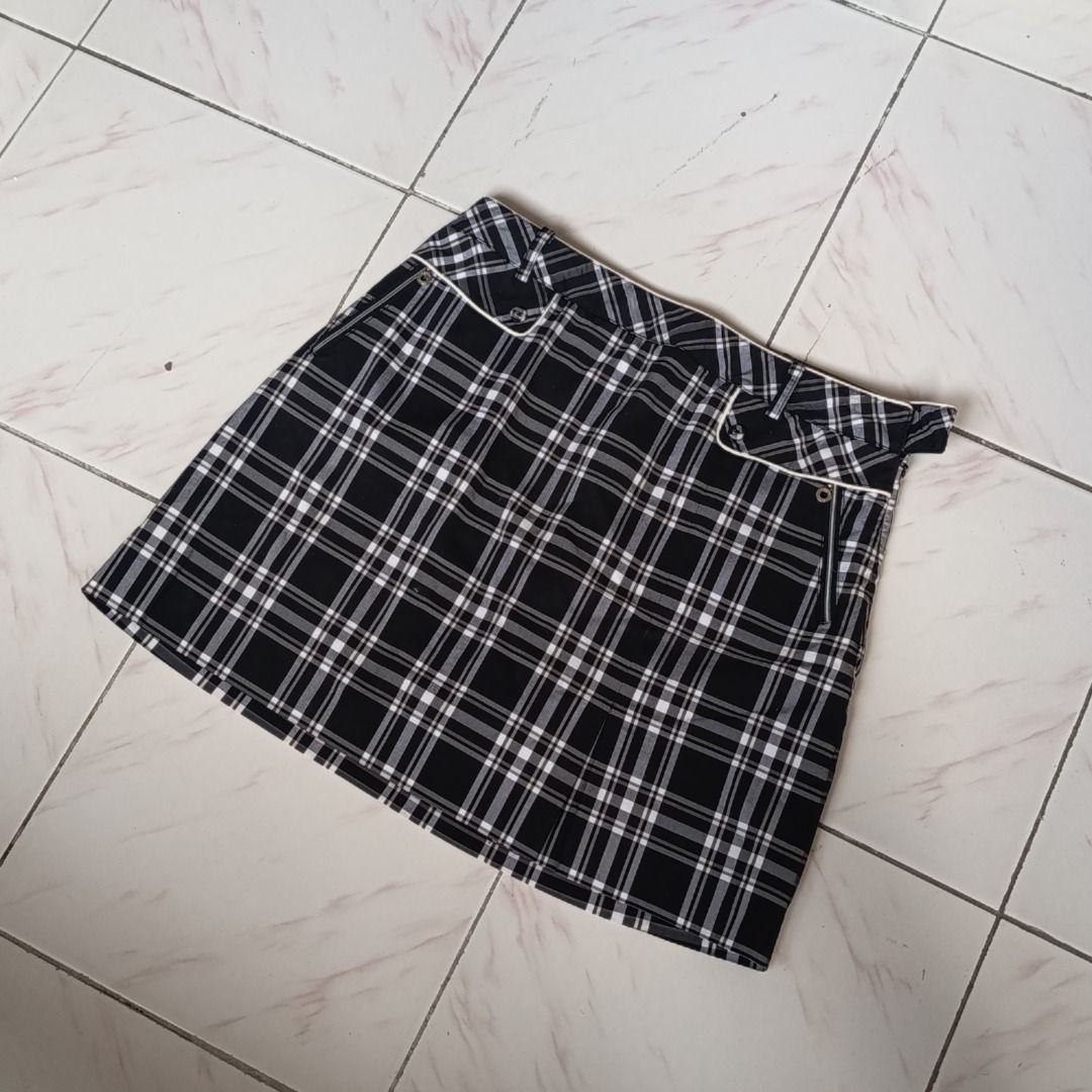 Black and White Plaid Mini Skirt (Category: Skirts) located in Davao. Submitted by lovedbyberry (Listing ID 1455659590, Image 1). Description: - Adorable black and white plaid mini skirt - Features a convenient side zipper - Stylish white trim detail on the waistband - Estimated to fit waist sizes 29-30 - Versatile for both casual and preppy looks.