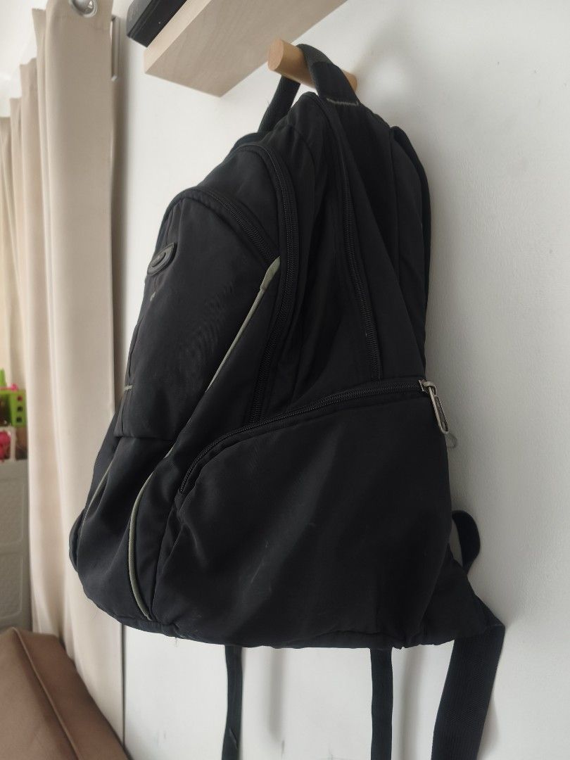 Black Backpack with Multiple Compartments (Category: Backpacks) located in San Pedro. Submitted by rakaswall (Listing ID 1455624478, Image 2). Description: - Black backpack - Main compartment and front pockets - Padded back and straps for comfort - Zippers in good working condition - Plenty of interior space - Minor exterior scuffs, overall good shape - Ideal for school or day trips.