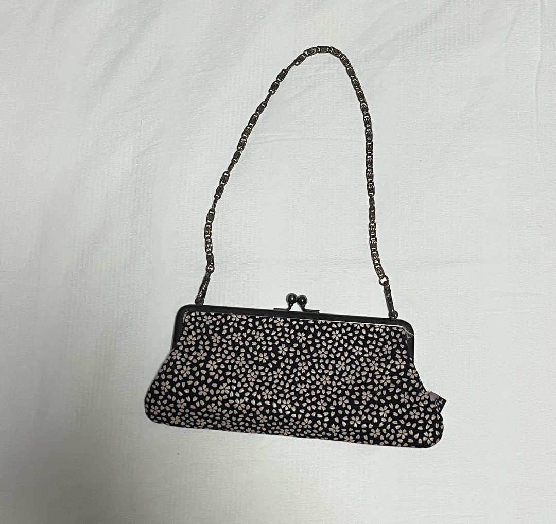Black floral clutch bag with chain strap (Category: Clutches) located in Quezon City. Submitted by mandysclothes (Listing ID 1455502627, Image 1). Description: Price: 400 + sf MOP: GCash.