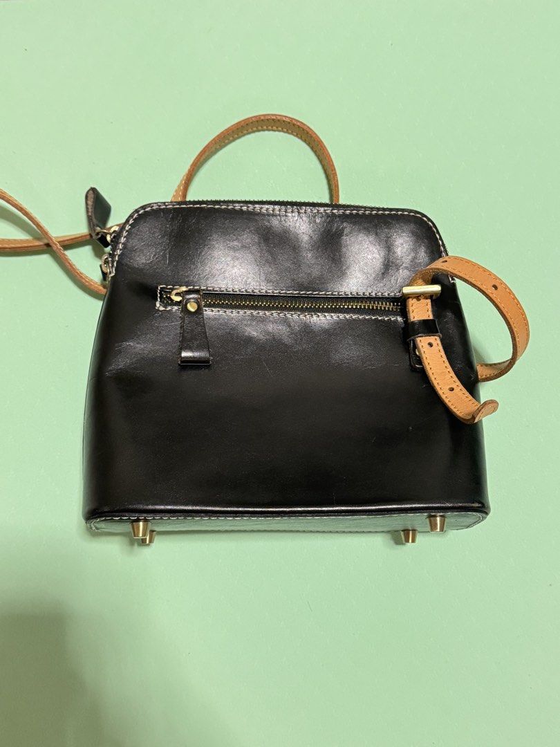 Black Leather Crossbody Bag with Tan Strap (Category: Cross-body Bags) located in Paranaque City. Submitted by gaftumar (Listing ID 1455548347, Image 2). Description: - Classic black leather crossbody bag - Adjustable tan leather strap - Elegant gold hardware details - Protective feet on the bottom - Secure zipper closure - Ideal for everyday use - Fits all your essentials.