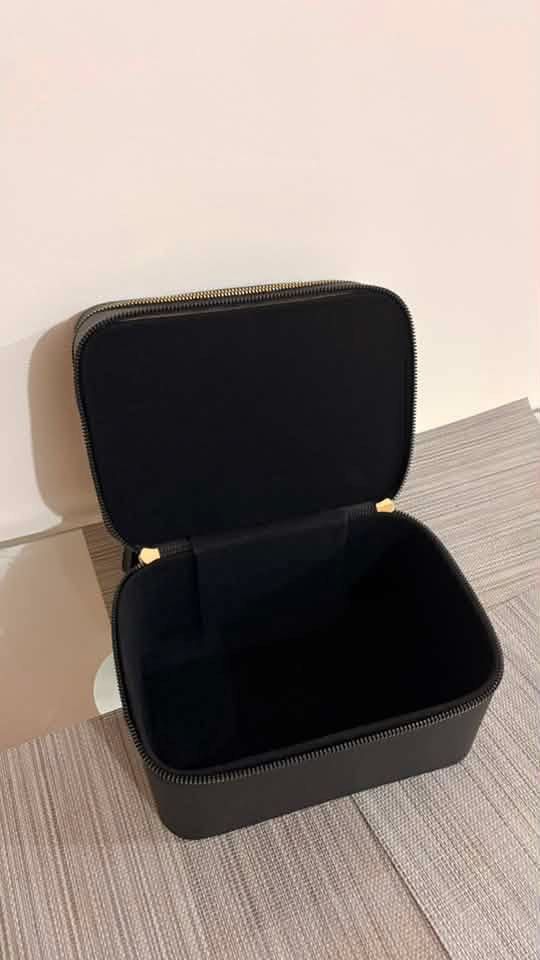 Black Makeup Vanity Case with Mirror and Zippers (Category: Makeup) located in Taguig. Submitted by styledmnl (Listing ID 1455500913, Image 2). Description: - Stylish black makeup case - Built-in mirror inside the lid - Two zippered compartments for ample storage - Convenient top handle for easy carrying - Ideal for organizing cosmetics and toiletries - Compact and travel-friendly design.
