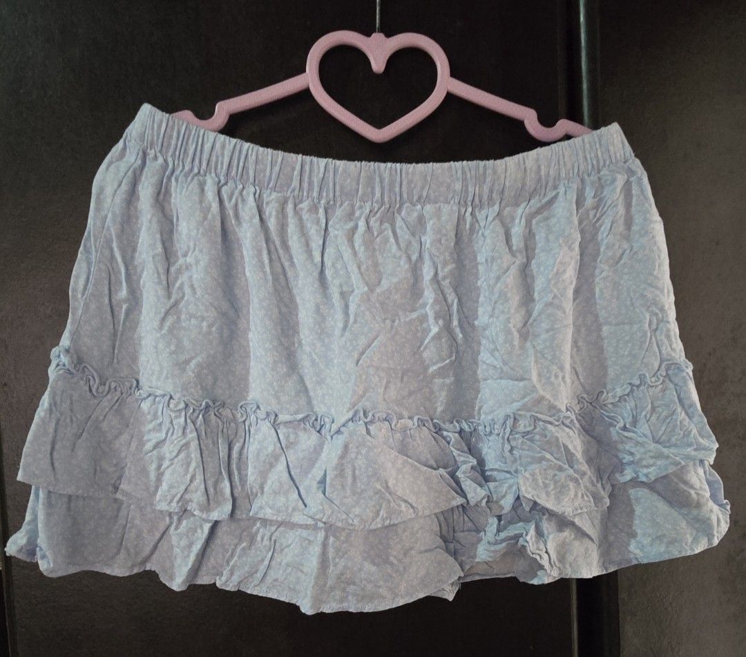Brandy Melville Light Blue Ruffle Mini Skirt (Category: Skirts) located in Dagupan City. Submitted by chislocker14 (Listing ID 1455506230, Image 1). Description: - Super cute Brandy Melville mini skirt - Light blue with floral details - Ruffled hem - Elastic waistband for comfort - Comfortable and flowy design - Perfect for casual or dressed-up looks.