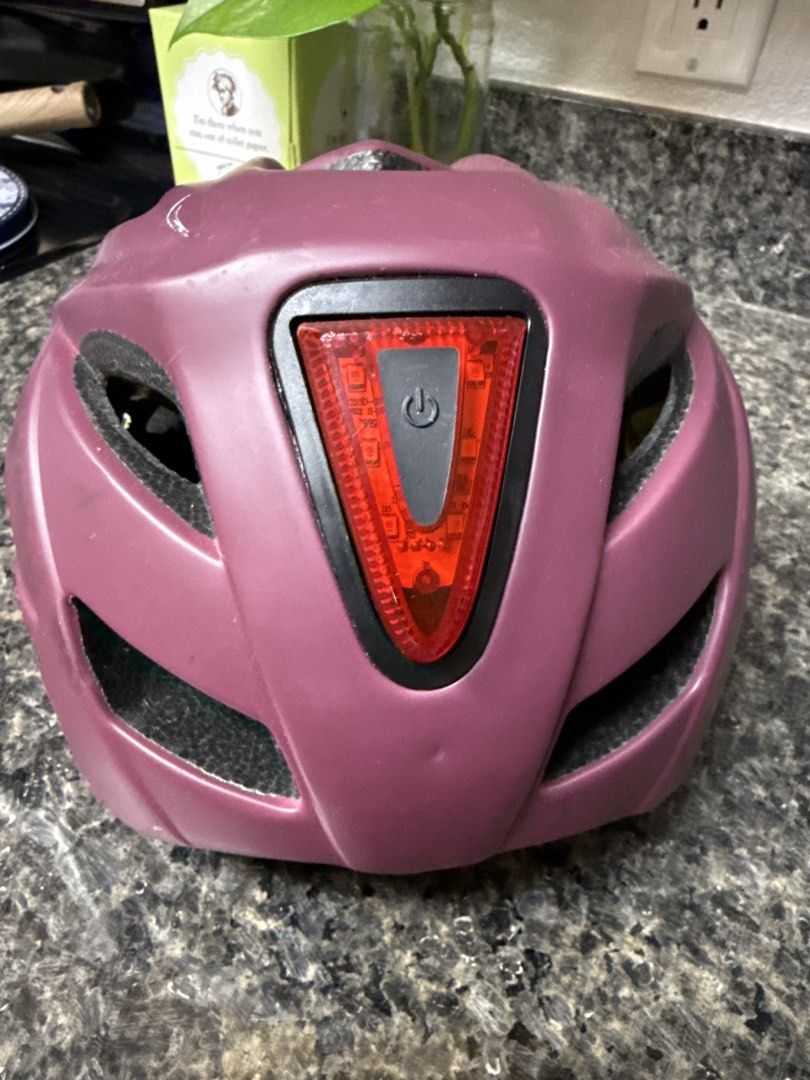 Cannondale Bicycle Helmet with Integrated Rear Light (Category: Bicycles) located in Las Pinas. Submitted by threadsofhumility (Listing ID 1455556586, Image 3). Description: - Purple Cannondale bike helmet - Integrated LED rear light for enhanced visibility - Adjustable straps and internal fit system for a secure and comfortable fit - Plenty of ventilation to keep you cool - Suitable for both road cycling and mountain biking The back lights is no