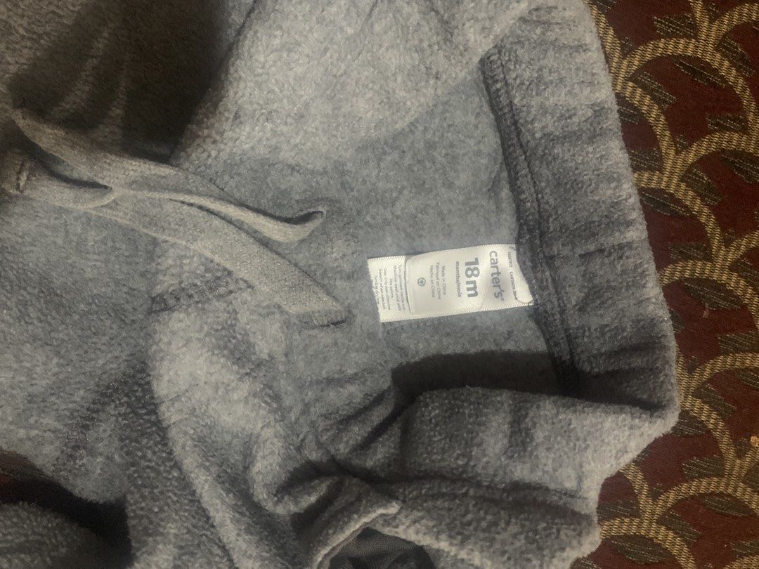 Carter's Grey Fleece Pants 18m (Category: Babies & Kids Fashion) located in Manila. Submitted by closetsunday (Listing ID 1455526294, Image 1). Description: - Brand: Carter's - Size: 18 months - Material: Soft and cozy fleece - Features: Elastic waistband with drawstring - Ideal for: Lounging, playing, easy dressing.