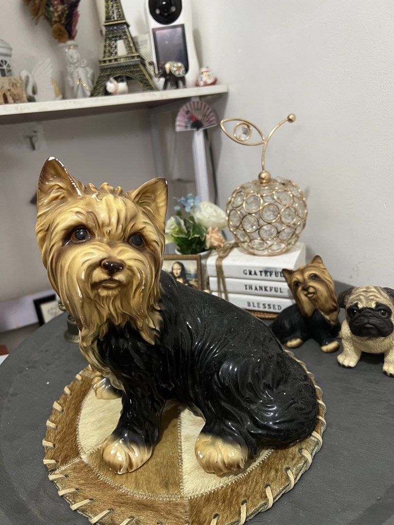 Ceramic Yorkshire Terrier and Pug Dog Figurines (Category: Other Home Decor) located in Las Pinas. Submitted by maple0305 (Listing ID 1455577472, Image 1). Description: - Adorable ceramic dog figurine set - Features a large Yorkshire Terrier in front - Accompanied by a smaller Yorkshire Terrier and a pug behind - Displayed on a textured round base - Ideal for shelf or table decoration - Adds a charming touch to any home - A must-have for dog enth