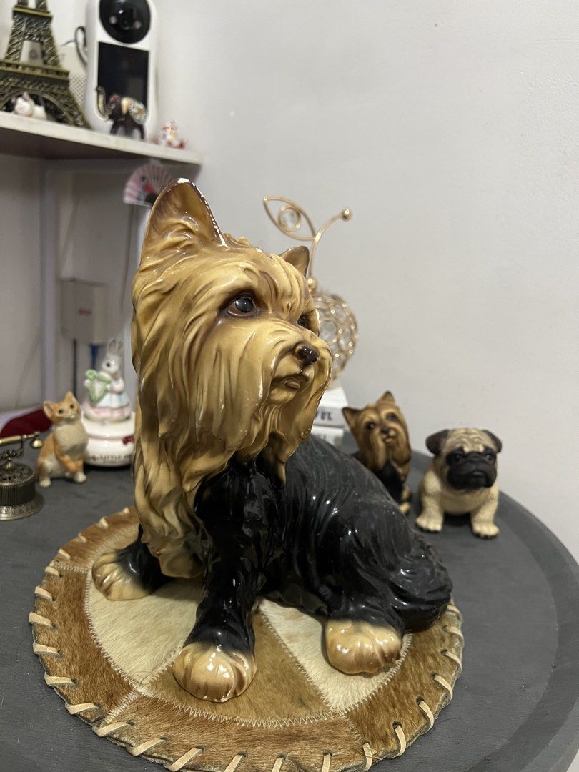 Ceramic Yorkshire Terrier and Pug Dog Figurines (Category: Other Home Decor) located in Las Pinas. Submitted by maple0305 (Listing ID 1455577472, Image 2). Description: - Adorable ceramic dog figurine set - Features a large Yorkshire Terrier in front - Accompanied by a smaller Yorkshire Terrier and a pug behind - Displayed on a textured round base - Ideal for shelf or table decoration - Adds a charming touch to any home - A must-have for dog enth