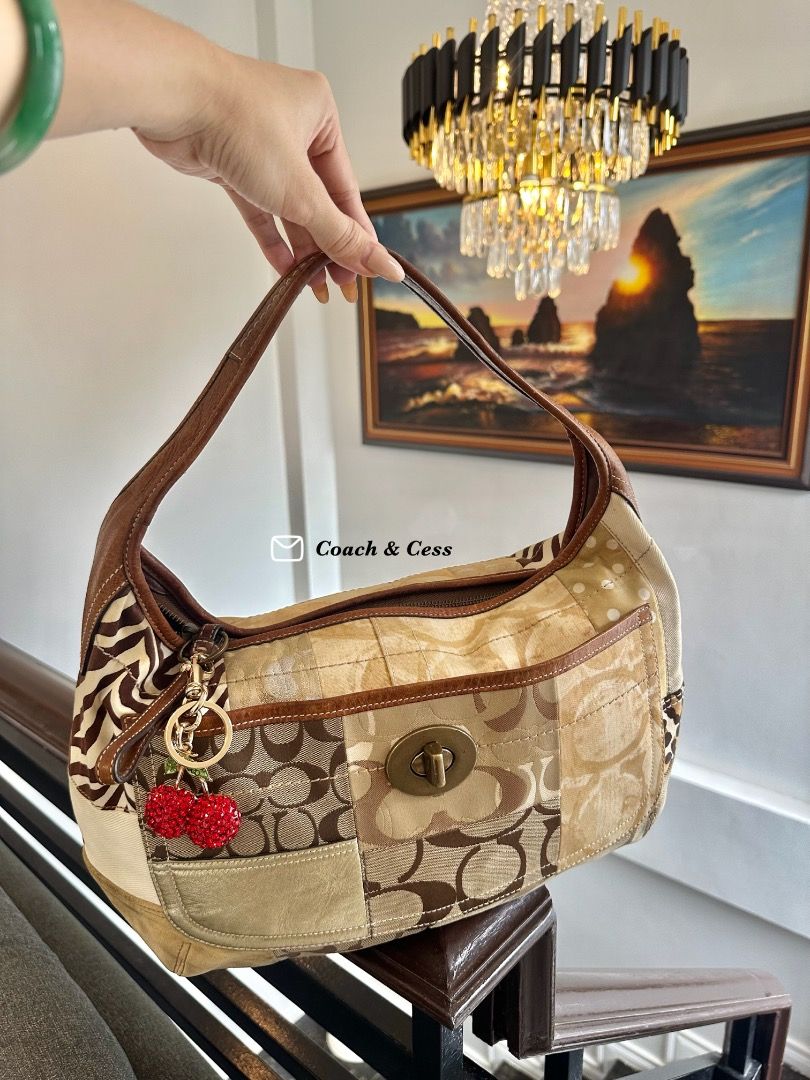 Coach Ergo Patchwork (Category: Shoulder Bags) located in Dagupan City. Submitted by emmanreyes (Listing ID 1455532126, Image 2). Description: - Brand: Coach - Model: Ergo Patchwork Hobo Bag - Design: Unique patchwork featuring Coach monogram, zebra print, and neutral tones - Material: Canvas with leather trim and strap - Features: Spacious main compartment, interior pockets, turn-lock closure, decorative charm - Style: Versatile, statement piece