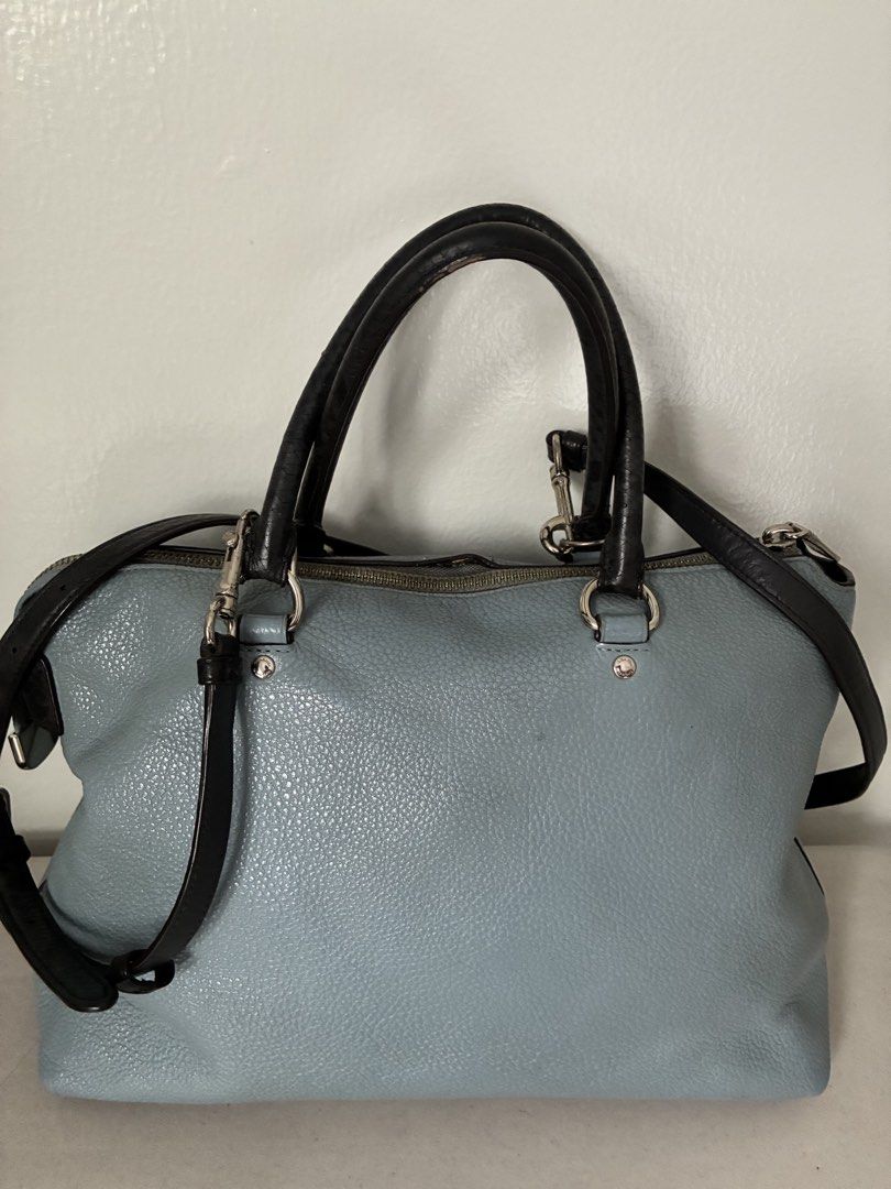 Coach Light Blue Leather Satchel Handbag (Category: Luxury Bags & Wallets) located in Manila. Submitted by snappyaura (Listing ID 1455624713, Image 3). Description: - Coach light blue pebbled leather satchel bag - Black leather top handles - Detachable shoulder strap - Silver hardware - Front slip pocket - Zip-top closure - Spacious interior - Minor marks on front (please check photos) Price negotiable.