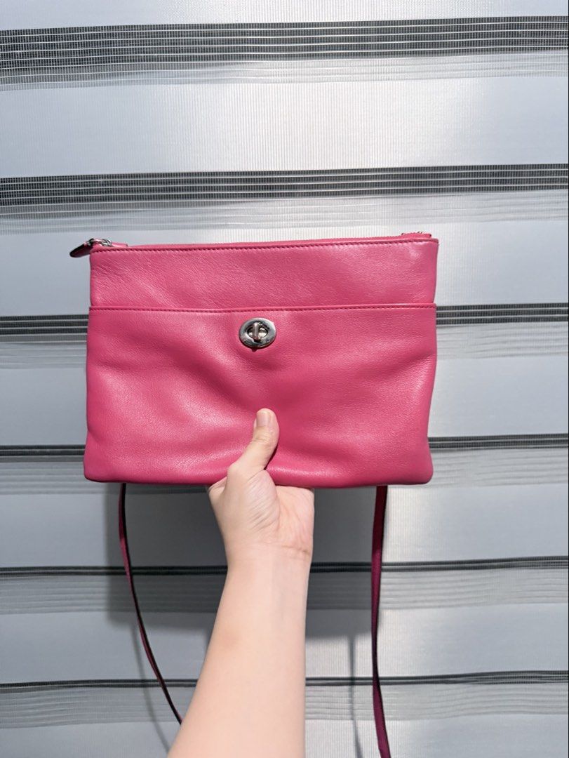 Coach Legacy Slim Turnlock Crossbody (Category: Luxury Bags & Wallets) located in Manila. Submitted by prelovedbygayle (Listing ID 1438338165, Image 1). Description: Material: Smooth, supple premium leather with a slight natural sheen. Front Pocket: A wide, accessible front slip pocket secured by Coach’s iconic polished silver-tone turnlock closure. Strap: A long, slender, adjustable leather shoulder strap attached with durable silver dog-leash c