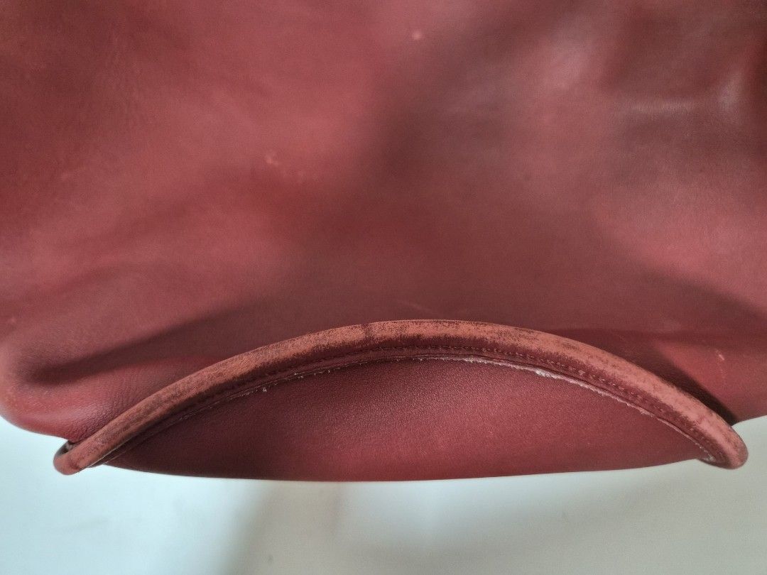 Coach Red Leather Duffle Sac XL (Category: Luxury Bags & Wallets) located in Muntinlupa City. Submitted by hcasi (Listing ID 1455512009, Image 3). Description: - Vintage cherry red leather Coach bucket bag - Classic adjustable strap - Genuine brass hardware - Signs of wear on leather and bottom edge (consistent with age) - Clean interior - Made in USA - Serial number visible in photos.