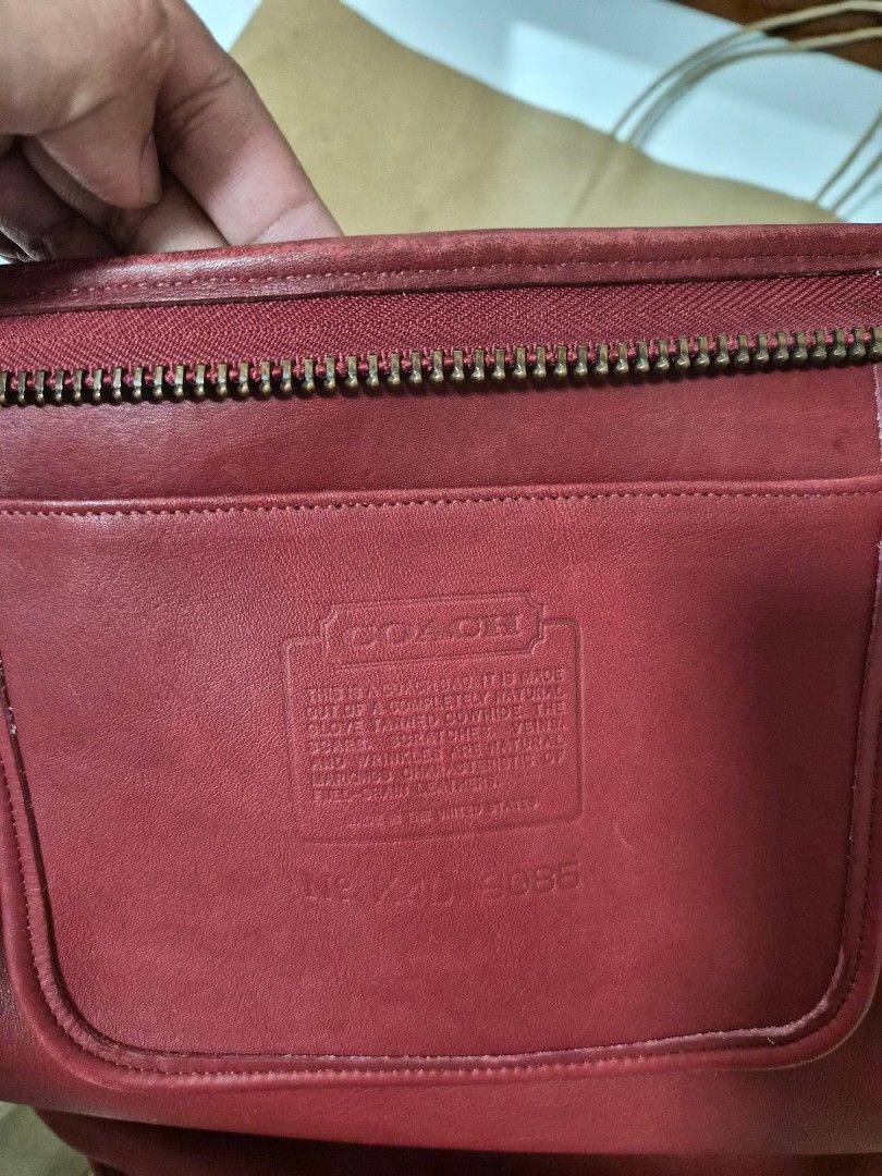 Coach Red Leather Duffle Sac XL (Category: Luxury Bags & Wallets) located in Muntinlupa City. Submitted by hcasi (Listing ID 1455512009, Image 2). Description: - Vintage cherry red leather Coach bucket bag - Classic adjustable strap - Genuine brass hardware - Signs of wear on leather and bottom edge (consistent with age) - Clean interior - Made in USA - Serial number visible in photos.