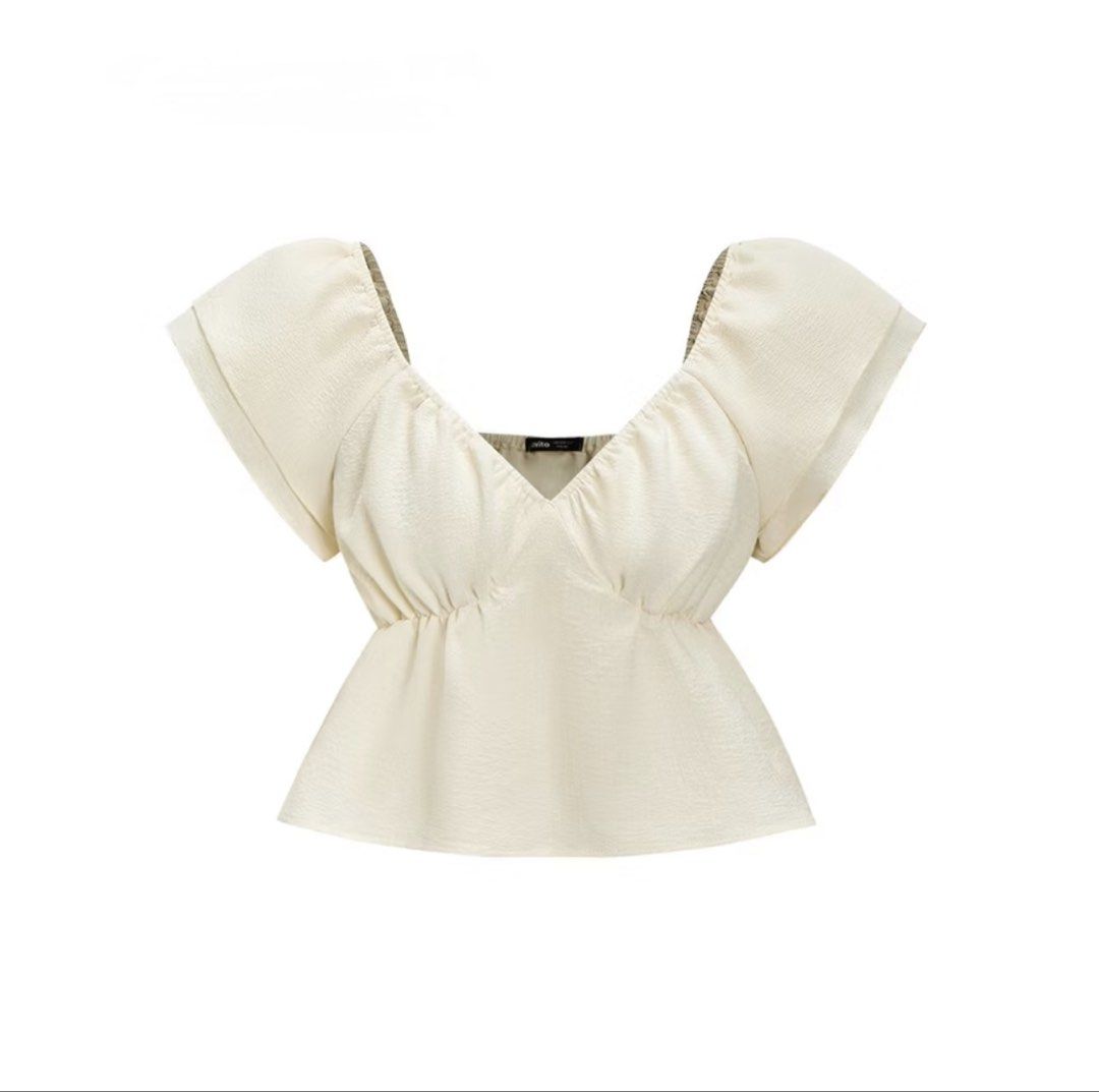 Cream Puff Sleeve Cinched Waist Top (Category: Blouses) located in Manila. Submitted by dleih (Listing ID 1455626442, Image 1). Description: - Cream colored top - Puff sleeves - Sweetheart neckline with ruching - Elasticated waist for a flattering peplum silhouette - Textured fabric - Perfect for dressing up or down.