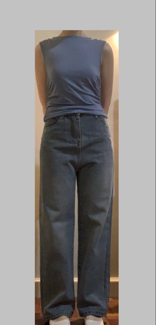 Dark Powder Blue Roushed Sleeveless Top (Category: Sleeveless) located in Paranaque City. Submitted by JarlemsApparel (Listing ID 1455621561, Image 2). Description: - Color: Dark Powder Blue/ Dusty Blue - nice quality fabric - a few stains (able to come off after laundry) - better for M body frames (hugs the body, but the roushing sinches the waist a bit, snatched!) Model: - 5’2 - S-M body frame.