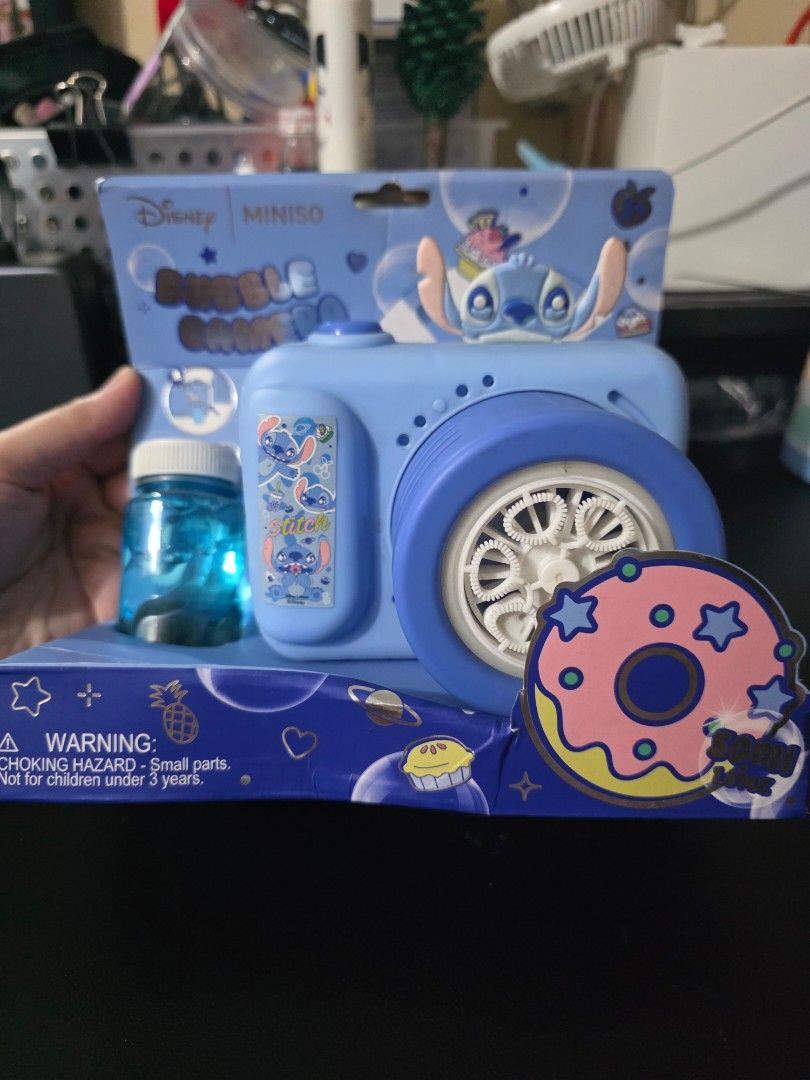 Disney Miniso Stitch Bubble Camera (Category: Designer & Blind Box Toys) located in Mandaluyong City. Submitted by kendykeyn (Listing ID 1455621949, Image 1). Description: - Cute blue bubble camera featuring Disney's Stitch. - Includes bubble solution and lace - Fun and easy-to-use toy for kids. - Perfect for outdoor play and bubbly fun!.
