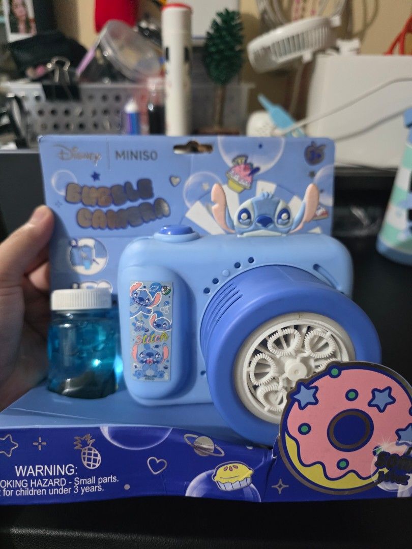 Disney Miniso Stitch Bubble Camera (Category: Designer & Blind Box Toys) located in Mandaluyong City. Submitted by kendykeyn (Listing ID 1455621949, Image 2). Description: - Cute blue bubble camera featuring Disney's Stitch. - Includes bubble solution and lace - Fun and easy-to-use toy for kids. - Perfect for outdoor play and bubbly fun!.