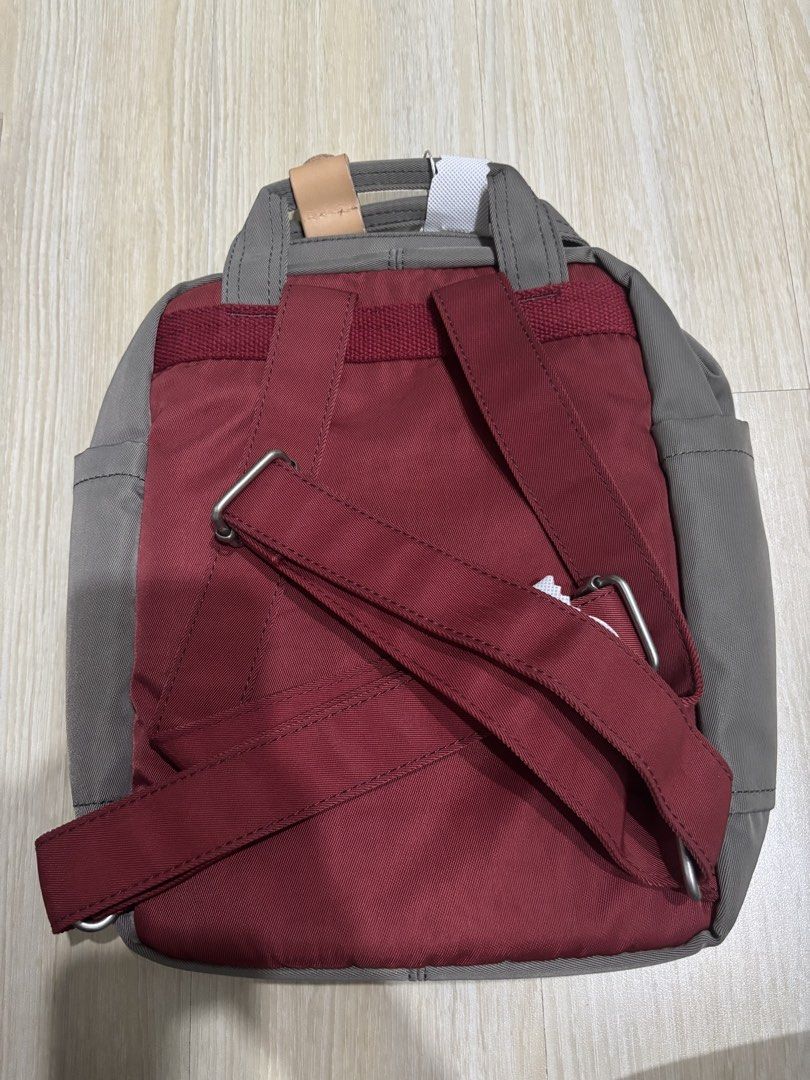 Doughnut Macaroon Mini Backpack (Category: Backpacks) located in Quezon City. Submitted by briesells (Listing ID 1455640475, Image 3). Description: RFS: decluttering Negotiable. PM me! (: Original price of macaroon mini bags is ₱2500. Selling for discounted price! Details: - Brand: Doughnut - Size on tag: mini backpack - Measurements: 21.5cm(W) X 9cm(D) X 30cm(H) - Color: Wine x Grey colorway (burgundy / red / maroon and grey) - Condition: BRAND 