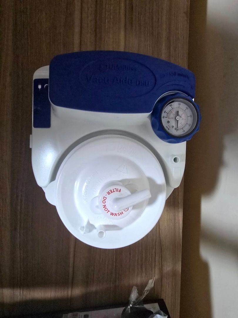 Drive DeVilbiss Suction Aide 7314 Portable Suction Machine (Category: Medical Supplies & Tools) located in Cainta. Submitted by reabilty (Listing ID 1455520904, Image 3). Description: - Drive DeVilbiss Suction Aide 7314 portable suction machine - Includes main unit, power adapter, and tubing - Features a gauge to monitor suction levels - Filter is present and marked 'Do Not Wash' - Comes in original box with manual - Great for home use.