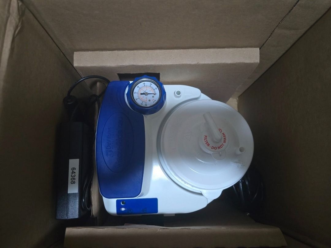 Drive DeVilbiss Suction Aide 7314 Portable Suction Machine (Category: Medical Supplies & Tools) located in Cainta. Submitted by reabilty (Listing ID 1455520904, Image 2). Description: - Drive DeVilbiss Suction Aide 7314 portable suction machine - Includes main unit, power adapter, and tubing - Features a gauge to monitor suction levels - Filter is present and marked 'Do Not Wash' - Comes in original box with manual - Great for home use.