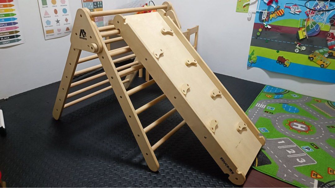 educratePh Easy fold Pickler triangle MAX with Jumbo Ramp and Climbing Frame(New version) (Category: Infant Playtime) located in Bulacan. Submitted by minimalistattorneymom (Listing ID 1455501260, Image 2). Description: - Complete Pikler triangle set: includes triangle climber, slide, and rock climbing wall. - Ideal for indoor active play, promoting gross motor skills. - Crafted from natural, durable wood. - Versatile slide attachment: can be pla