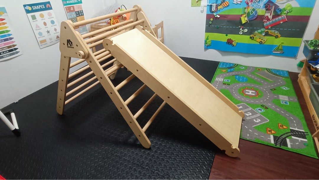 educratePh Easy fold Pickler triangle MAX with Jumbo Ramp and Climbing Frame(New version) (Category: Infant Playtime) located in Bulacan. Submitted by minimalistattorneymom (Listing ID 1455501260, Image 1). Description: - Complete Pikler triangle set: includes triangle climber, slide, and rock climbing wall. - Ideal for indoor active play, promoting gross motor skills. - Crafted from natural, durable wood. - Versatile slide attachment: can be pla