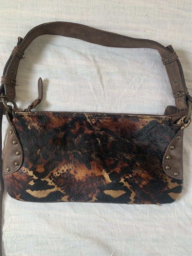 Fosco Branded Shoulder Bag With Animal Design (Category: Shoulder Bags) located in Cebu City. Submitted by team13ios (Listing ID 1455515290, Image 2). Description: small shoulder bag made with faux fur or a hair-on-hide texture, featuring a dark brown, black, and tan animal print. Similar styles are often categorized as small animal-print baguette or shoulder purses W-5.4 L-11 Sign of Use Issue- matigas kunti ung zipper don sa part see photos per