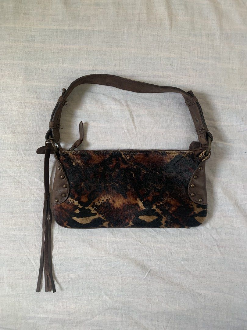 Fosco Branded Shoulder Bag With Animal Design (Category: Shoulder Bags) located in Cebu City. Submitted by team13ios (Listing ID 1455515290, Image 1). Description: small shoulder bag made with faux fur or a hair-on-hide texture, featuring a dark brown, black, and tan animal print. Similar styles are often categorized as small animal-print baguette or shoulder purses W-5.4 L-11 Sign of Use Issue- matigas kunti ung zipper don sa part see photos per
