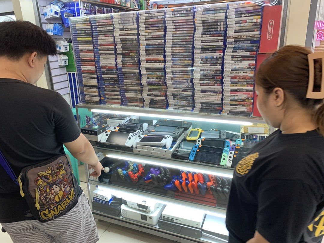 Gaming shop (Category: Nintendo) located in San Juan City. Submitted by safe.trusted_legitseller (Listing ID 1455600798, Image 1). Description: For sale: 1. 🎮 PS5 games 2. 🎮 PS4 games 3. 🎮 Nintendo Switch games 4. 🕹️ PS5 controllers / DualSense 5. 🕹️ Nintendo Switch consoles 6. 🎮 Switch Joy-Con 7. 🎮 Handheld gaming consoles 8. 📽️ Projectors 9. 🎮 Used gaming bundles.